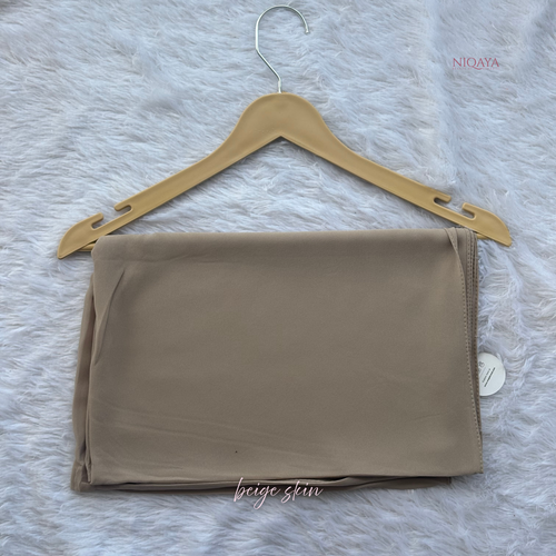 Beige strapless top on a hanger with 'NIOAYA' branding on a textured gray background.