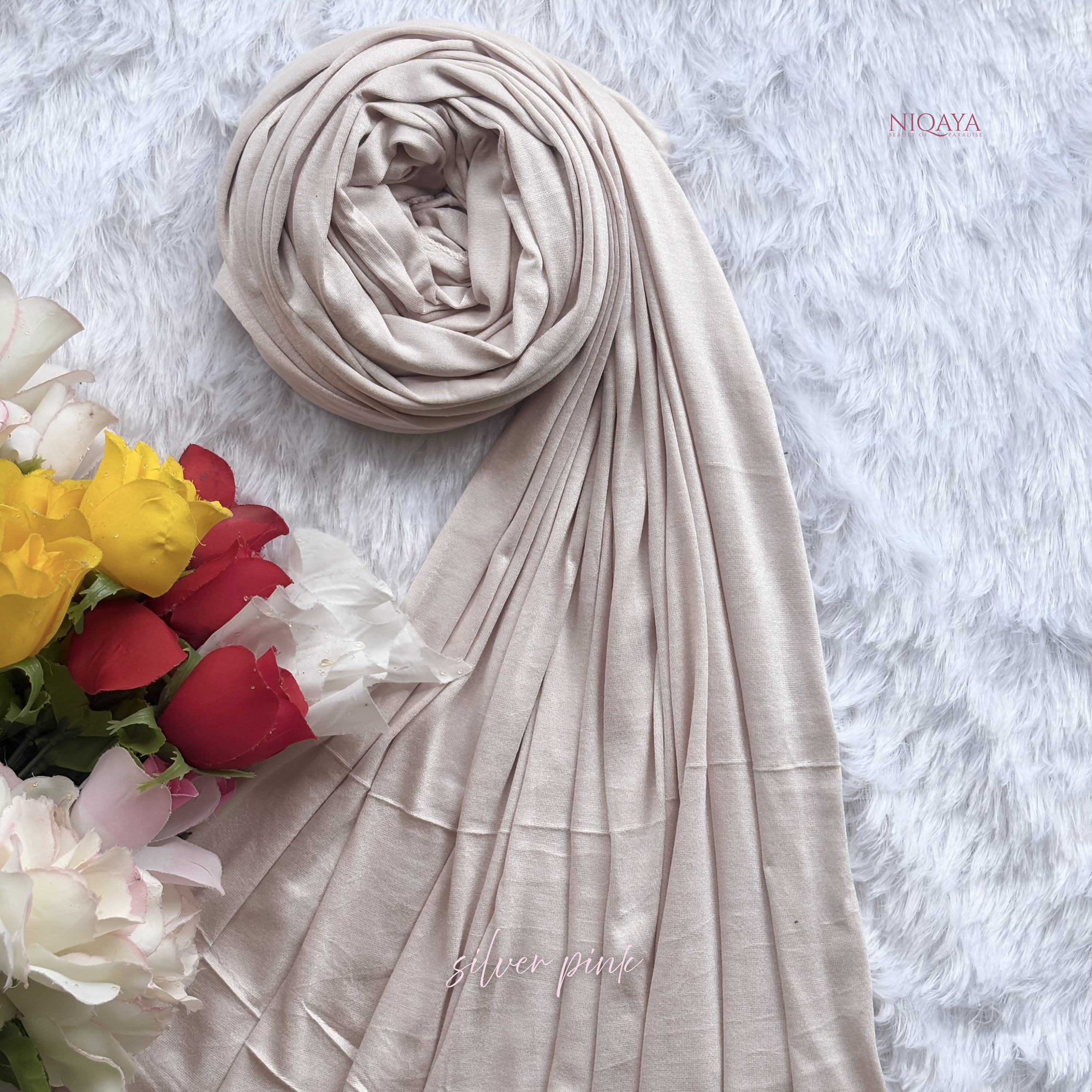 Beige hijab with flowers on a textured white background